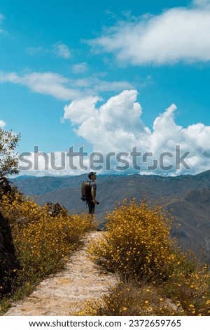 vertical photo silhouette of tourist with backpack ,Travel healthy lifestyle solo excursion active vacation outdoors, Wide mountain panorama, Beauty of nature,tourism,