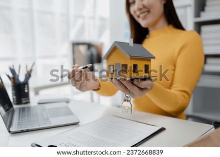 Housing project sales staff make sales presentations of various types of houses. to customers who visit and explain trading details. Home and real estate salesperson concept.