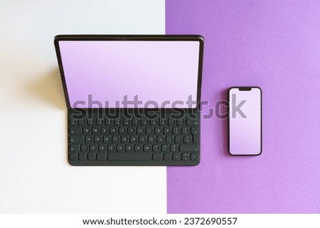 Laptop and smartphone. Blank screen mockup. Smart devices. Colorful background.