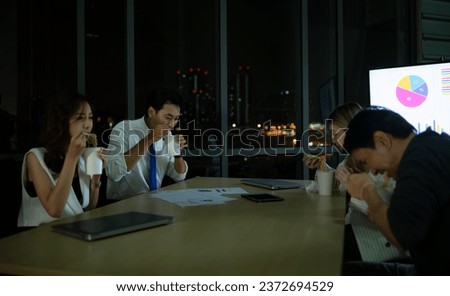 Group of broker international stock traders taking a break by eating instant noodles, International financial investment company concept