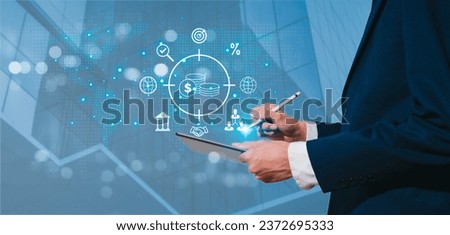 A businessman show the world while displaying various business icons, global big data, internet connection application. Financial and banking concepts, as well as digital marketing, link technologies.