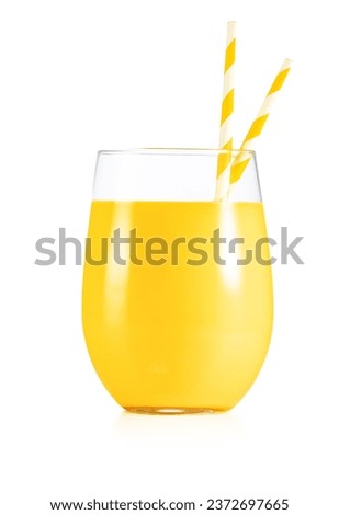 Closeup of pineapple juice glass with paper drinking straws isolated on white background. Real studio shot.