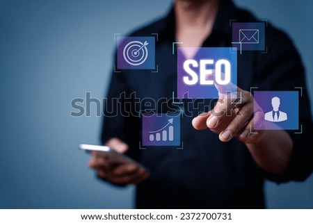 Search engine optimization marketing ranking. Working on computer with the icon of online search engine, abbreviation SEO and SEO symbol. Digital marketing strategy of promote traffic to website. Royalty-Free Stock Photo #2372700731