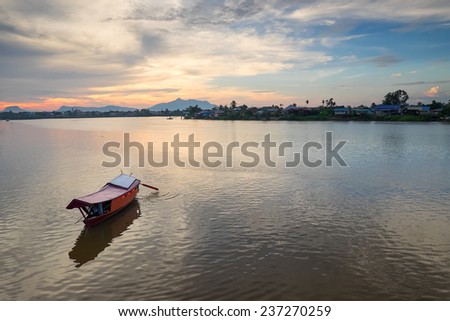 A sunset view of Sarawak`s river with Mount Serapi as the background, Sarawak  Malaysia.(Landscape layout)