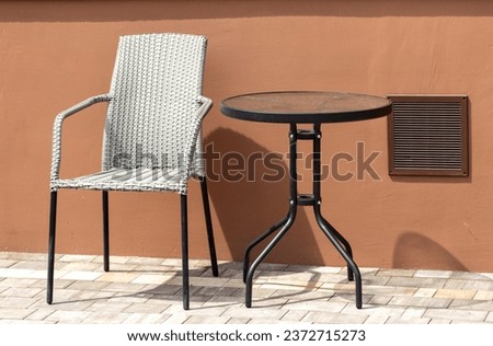 Outdoor garden set with a comfortable chair and table for ultimate relaxation. Enjoy the peaceful ambiance of nature.