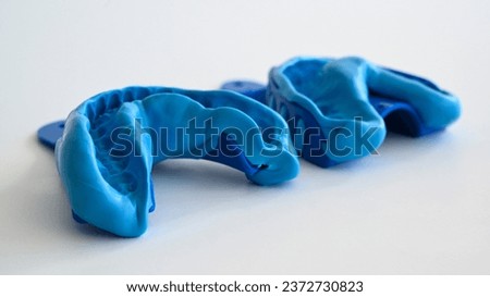 Close up of a dentist dental technique bite impression - molding trays. Royalty-Free Stock Photo #2372730823