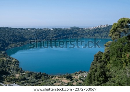 Small historical town Nemi, view on green Alban hills overlooking volcanic crater lake Nemi, Castelli Romani, Italy in summer, near Rome