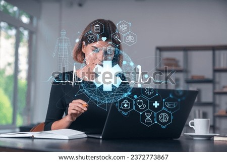 Pensive attractive beautiful businesswoman in formal wear working on laptop at office workplace in background. flying medical icons. Concept of health care and insurance. Table, notebook.