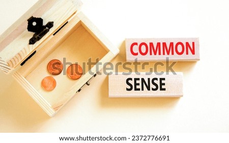 Common sense symbol. Concept words Common sense on beautiful wooden block. Beautiful white table white background. Wooden chest with coins. Business, motivational common sense concept. Copy space.