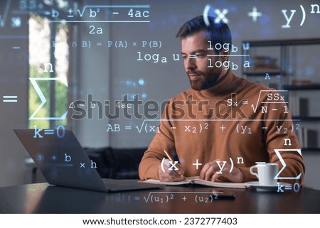 Thoughtful businessman in casual wear typing on laptop at office workplace. Concept of hard work, business education, internet surfing, information technology. Education hologram
