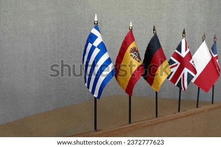 Desktop Flag of Greece against the background of flags of other countries Royalty-Free Stock Photo #2372777623
