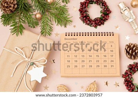 Christmas background with calendar for December and xmas decoration. Winter holidays celebration concept. Flat lay, top view 