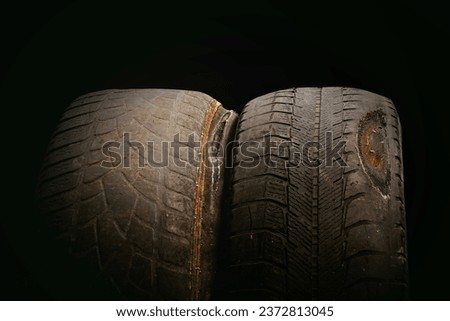 old worn damaged tire isolated as pattern of damaged tire for advertising tire shop or car tire shop