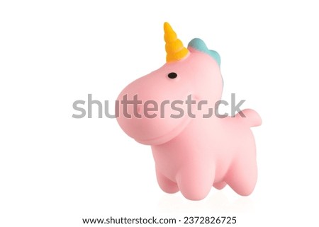 Pink unicorn toy on a whit background. 
Soft toy unicorn.
Squishy Toys. 