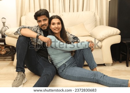 Portrait of happy young romantic couple in love enjoy resting on cozy couch sofa in living room. happy moment, harmonic relationships, love making care and enjoying weekend time together, copy space