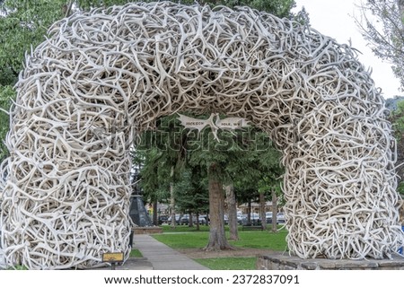 Iconic arch constructed from elk antlers at the corners of a public square in Jackson, Wyomong