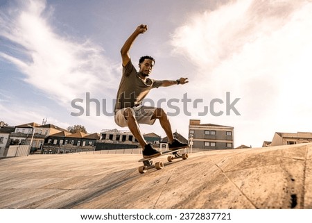 Surf skater training surfing moves on a urban scene. Royalty-Free Stock Photo #2372837721
