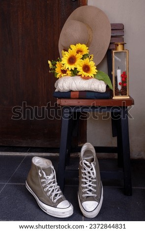 Depok, West Java, Indonesia, October 8, 2023, Shoes Still life Photography, sneakers composition with flower