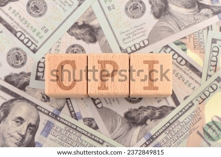 Text blocks on USD banknote props: CPI Royalty-Free Stock Photo #2372849815