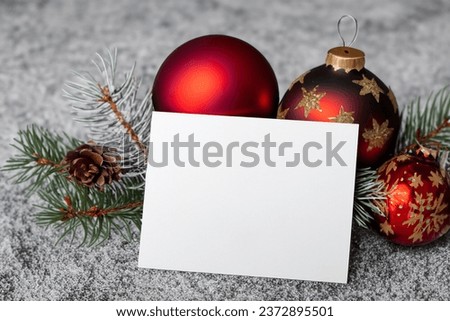 beautiful mockup of a white card with christmas ornaments on the side of the card