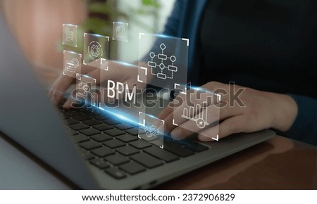 BPM Business Process Management concept. The tool for businesses to optimize operations, streamline processes, improve efficiency, and reduce costs. Working on computer  with BPM icons. Royalty-Free Stock Photo #2372906829