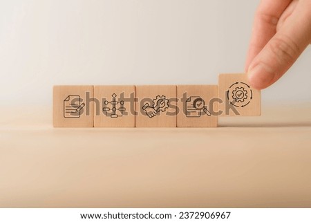 BPM Business Process Management concept. The tool for businesses to optimize operations, streamline processes, improve efficiency, and reduce costs. Placing wooden cube block with BPM text and icons. Royalty-Free Stock Photo #2372906967