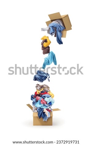 clothes spill out of box into paper box