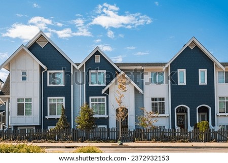 New Modern Apartment Buildings in Vancouver BC. Canadian modern residential architecture on sunny day. Canadian modern residential architecture, low-rise new townhouses. Neighborhood modern houses Royalty-Free Stock Photo #2372932153