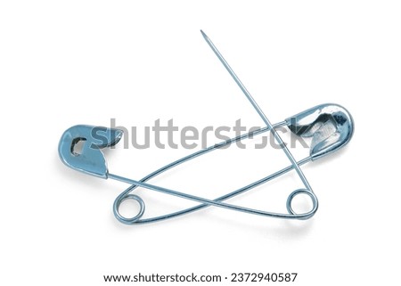 Diaper Safety pin opened office supply use household equipment stainless steel  sharpen sewing cloth isolated on white background. This has clipping path. full depth field.