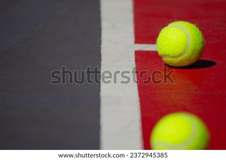 selective focus, two tennis ball in a tennis court