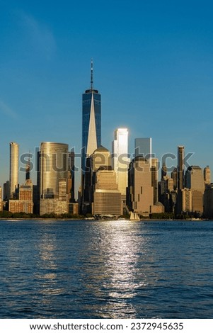 manhattan skyline in sunset. new york city. skyscraper building of nyc. ny urban city architecture. midtown manhattan and hudson river. metropolitan city cityscape. new york downtown in sunlit