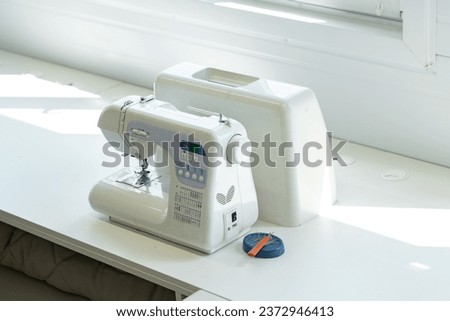 Sewing machine in textile factory close up