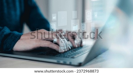 Document management system Businessman working on laptop computer productivity checklist and filling survey form online.checklist and clipboard task management. Royalty-Free Stock Photo #2372968873