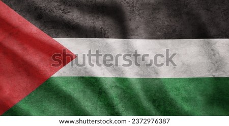 Weathered flag of Palestine, grunge rugged condition waving Royalty-Free Stock Photo #2372976387