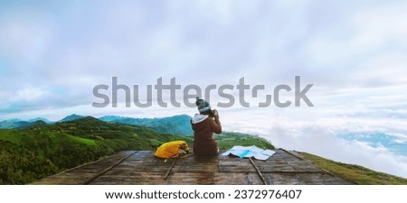 women asians travel relax in the holiday. Photograph landscape on the Moutain.Thailand