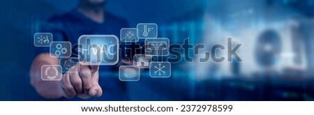 Businessman touching on virtual screen and presses HVAC button. Use of various technologies to control the temperature, humidity, and purity air. HVAC - Heating Ventilation Air Conditioning Concept  Royalty-Free Stock Photo #2372978599