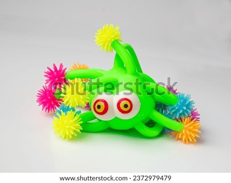 Bright Colored Toy, Colorful Squeeze Antistress Toys, Soft Squishy Spider on Elastic Band, Color Plastic Puffer Balls, Fun Luminous Stressball, Rubber Monster Hedgehog Royalty-Free Stock Photo #2372979479