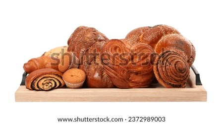 Wooden tray with different pastries isolated on white Royalty-Free Stock Photo #2372989003