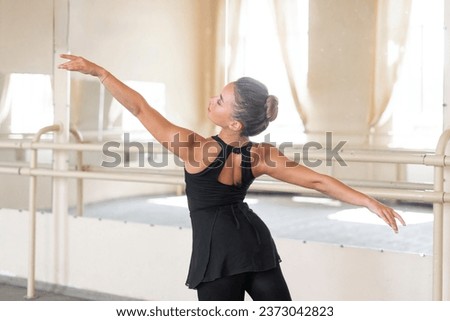 young female ballerina raising hands, grace classic moves