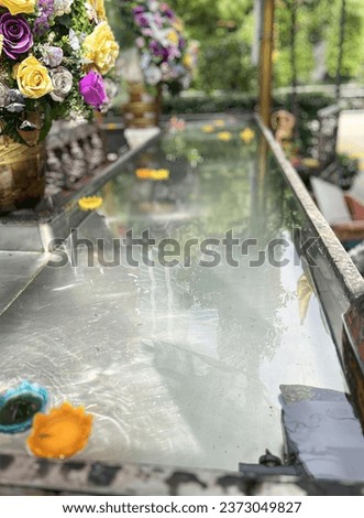 a glass top bar with a view of the pool. Royalty-Free Stock Photo #2373049827