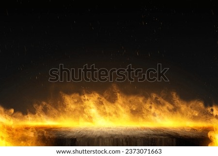 Concrete floor with fire flame on a dark background. Scary Halloween background concept