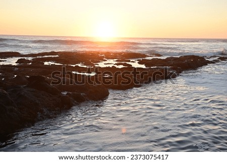 rocky Oregon coast beach at sunset