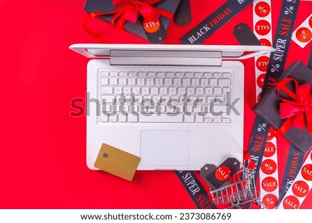 Black friday shopping and day background, Black Friday advertisement, sale promotion invitation with black red gift boxes, laptop, shop tags, crossed sale ribbons, copy space