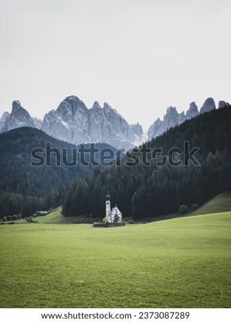 St. John's Chapel in Ranui, Santa Maddalena, Funes Valley, South Tyrol, Italy in front of Odles group mountains (germ. Geislergruppe) Royalty-Free Stock Photo #2373087289