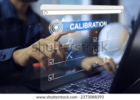 Engineer or lab staff pointing on instrument calibration in to control the accuracy of measurement error within the range specified by standard. iso iec 17025 laboratory management certified concept. Royalty-Free Stock Photo #2373088393