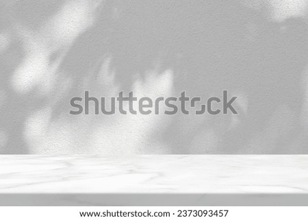 Marble Table with White Stucco Wall Texture Background with Leave Shadow, Suitable for Product Presentation Backdrop, Display, and Mock up.