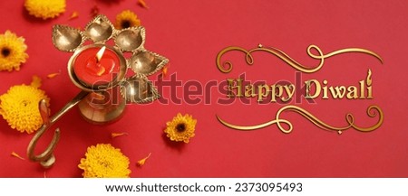 Greeting card for Indian holiday Diwali (Festival of lights) with diya lamp and flowers Royalty-Free Stock Photo #2373095493