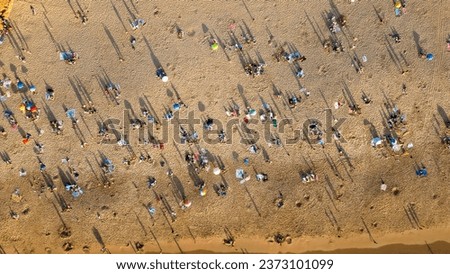 Birds eye view from people crowd relaxing on the beach in Cascais,Portugal