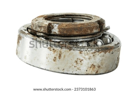 Bearing on a white background. Old worn bearing covered with rust