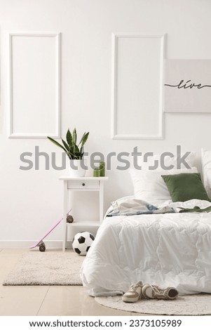 Interior of children's bedroom with soccer ball and skateboard
